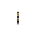Regalia Aura gold nose ring featuring alternating black and white stones in a vertical close-up view
