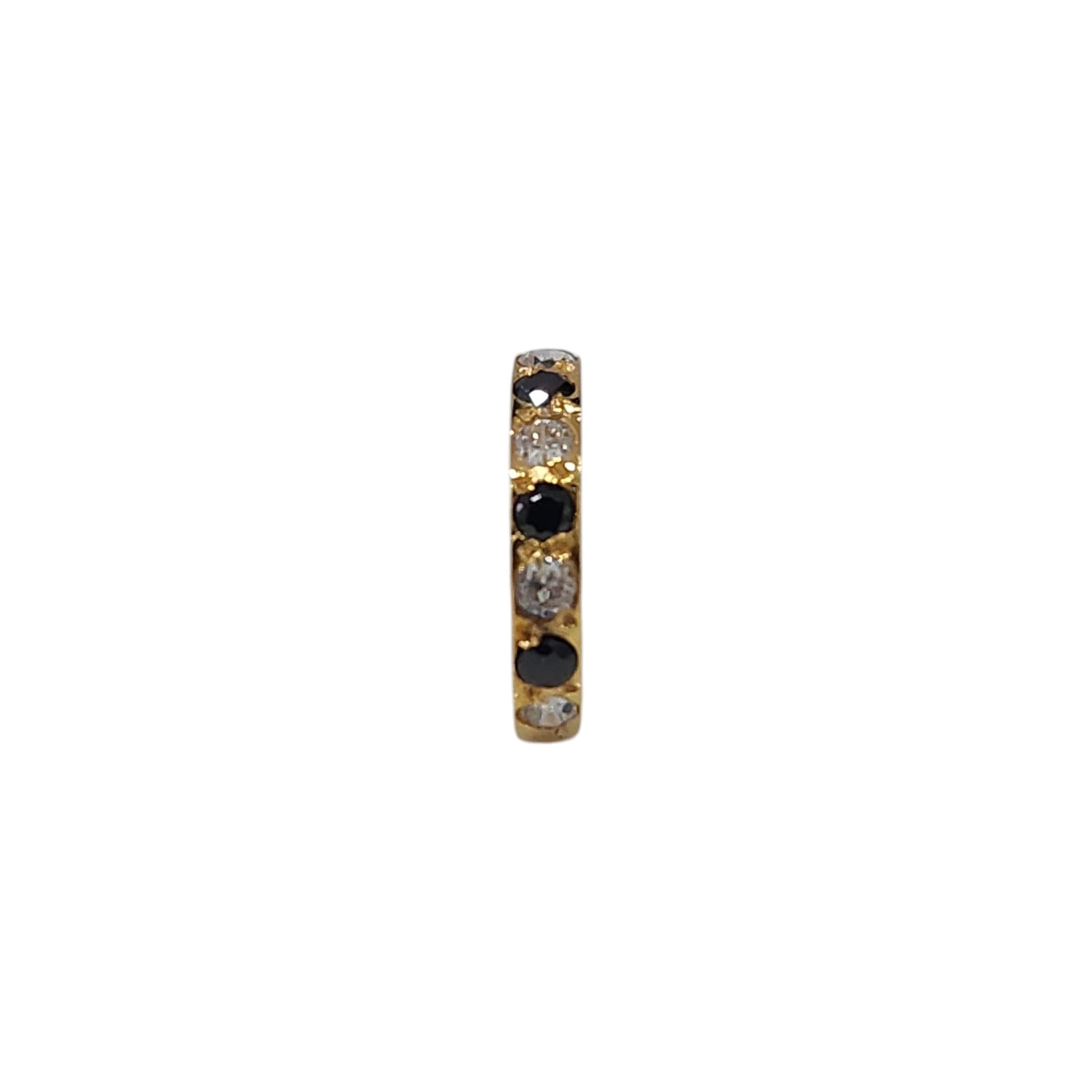 Regalia Aura gold nose ring featuring alternating black and white stones in a vertical close-up view