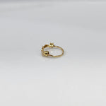 Stars Prism gold nose ring in 18K gold featuring star-shaped design, shown in angled studio view on plain background