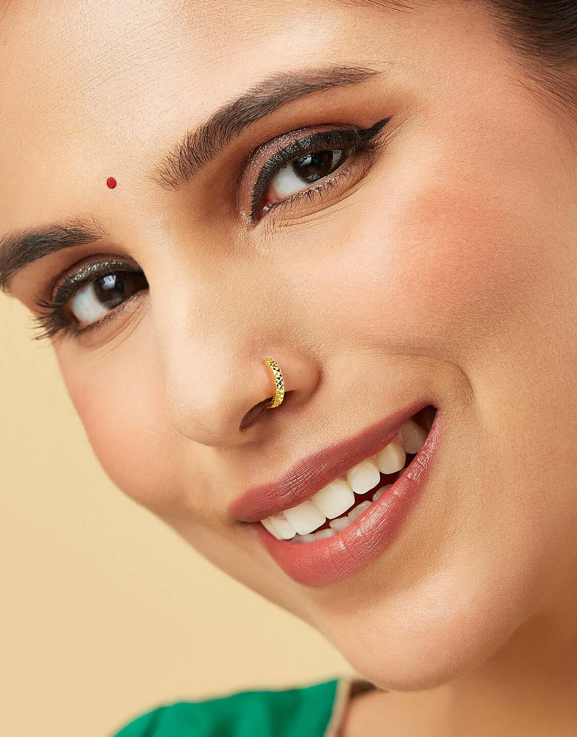 Twist Mosaic gold nose pin in 18K worn by model, textured hoop design for elegant traditional look