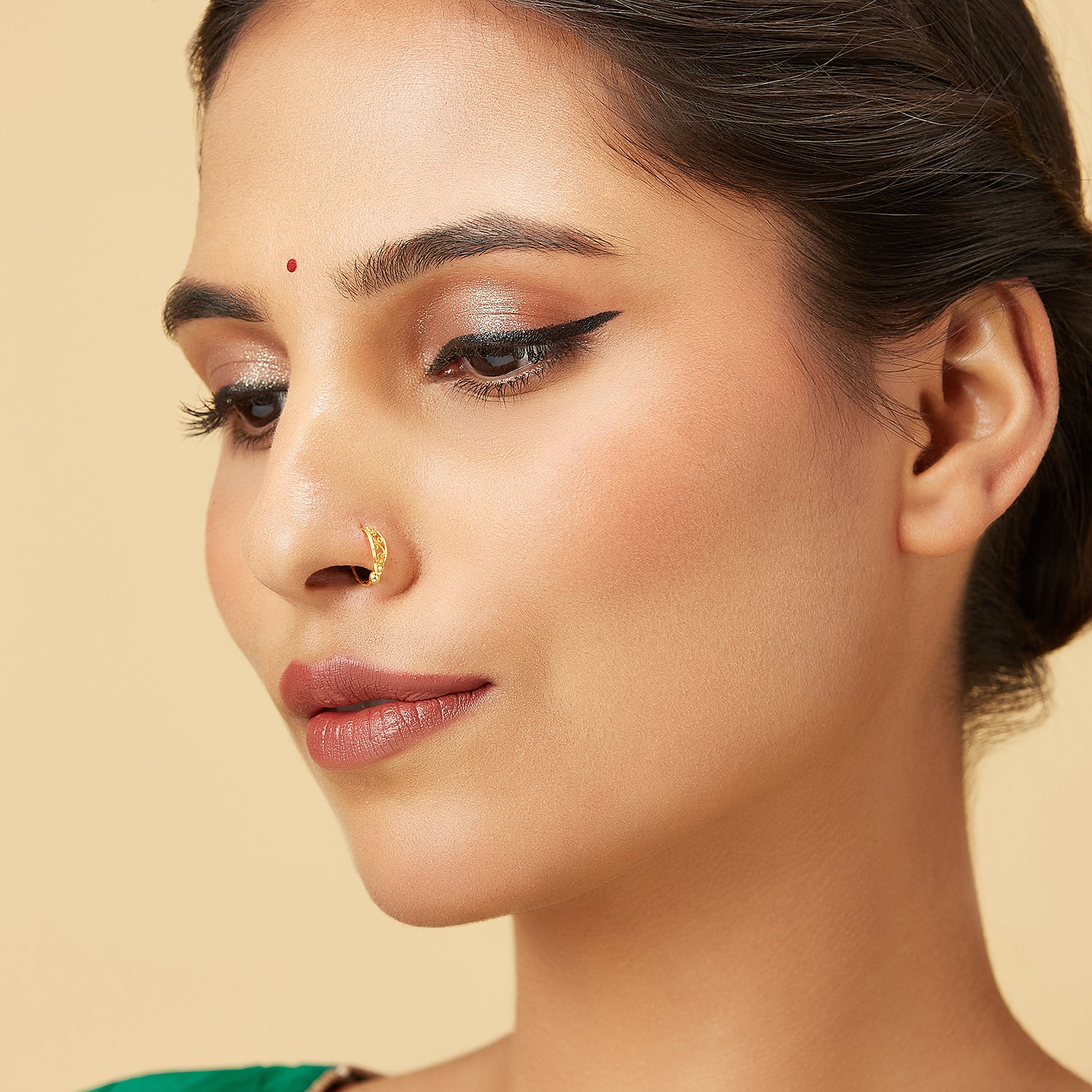Model wearing Vine Loop Gold Nose Ring in 18K gold with delicate vine-inspired filigree design from Yuvora