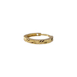 Viva Mosaic gold nose pin in 18K gold with geometric engraved patterns shown from an angled view